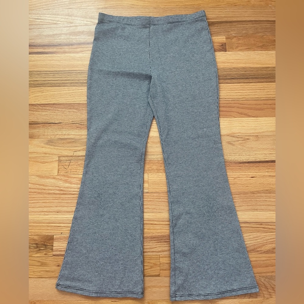 Plaid black and white slightly flared pants for young teens.